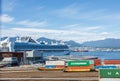 Scenic view of Vancouver Waterfront Station railroad featuring containers, with the Canada Place building in the background,