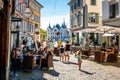 Scenic view of Vevey old town with people at cafe terrace and Aile castle in background on sunny summer day in Vevey Vaud