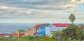 Scenic view of vibrant colour houses, sea and blue sky with clouds and copy space in Santa Cruz de La Palma in Spain