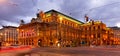 Vienna cityscape with central avenue and State Opera with evening illumination