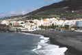 Scenic view of village and volcanic beach Royalty Free Stock Photo