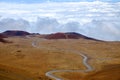 Scenic view of volcanic landscape and curvy road on Mauna Kea Royalty Free Stock Photo