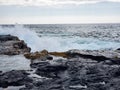 Scenic view of a wave crashing onto a rocky cliff Royalty Free Stock Photo