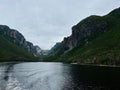 Scenic view of Western Brook Pond under a cloudy sky in Newfoundland and Labrador, Canada