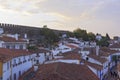 Scenic view of white houses red tiled roofs. and castle of Obidos from wall of fortress. Beautiful old town with medieval Royalty Free Stock Photo