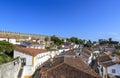 Scenic view of white houses red tiled roofs, and castle from wall of fortress. Beautiful old town with medieval. Obidos village, Royalty Free Stock Photo