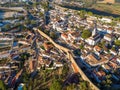 Scenic view of white houses red tiled roofs, and castle from wall of fortress. Obidos village, Portugal. Royalty Free Stock Photo