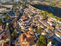 Scenic view of white houses red tiled roofs, and castle from wall of fortress. Obidos village, Portugal. Royalty Free Stock Photo