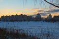 Scenic view of willow trees and poplars close to the frozen Dnieper River in Kyiv during sunset in winter Royalty Free Stock Photo