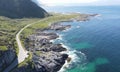 Scenic view of a winding mountain road dotted with coastal rocks. Henningsvaer, Norway. Royalty Free Stock Photo