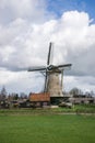 Traditional dutch windmill against a dutch cloud sky near Gouda, Holland