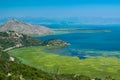 Scenic Viewpoint. Beautiful summer landscape of Skadar Lake with green and blue water, mountains hills. Montenegro Royalty Free Stock Photo