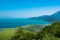 Scenic Viewpoint. Beautiful summer landscape of Skadar Lake with green and blue water, mountains hills. Montenegro Royalty Free Stock Photo