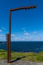 Scenic viewpoint at the Kilkee Cliffs on the Wild Atlantic Way in western Ireland with the typical signpost