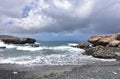 Scenic Views of Aruba`s Black Sand Stone Beach Royalty Free Stock Photo