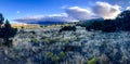 Scenic vista of majestic mountains and lush hills with puffy white clouds in the sky in Colorado Royalty Free Stock Photo