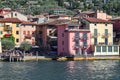 there are many colorful houses along this bay and some people in the docks