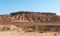 Scenic weathered yellow hill in stone desert