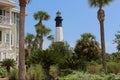 Scenic White And Black Lighthouse Beside Vacation Home