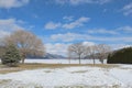 Scenic winter field and lake landscape