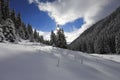 Scenic winter landscape with forest trees covered by snow in a very beautiful sunny day of winter. Royalty Free Stock Photo