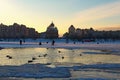 Scenic winter landscape of Obolon neighborhood. Fishermen are fishing on the frozen part of the Dnieper River.