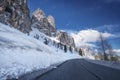 Scenic winter view from the asphalt road in the mountains covered with snow and trees on the side of the road on a Royalty Free Stock Photo