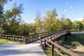 Scenic wooden bridge over a narrow lake connection in Bundek city park, Zagreb, Croatia Royalty Free Stock Photo