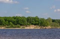 Scenis view of blue river bay, trees and sky