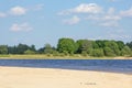 Scenis view of blue river bay, trees and sky