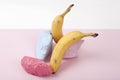 a scenographic composition of a still life composed of ripe bananas and brightly painted pebbles Royalty Free Stock Photo