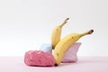 a scenographic composition of a still life composed of ripe bananas and brightly painted pebbles Royalty Free Stock Photo