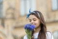 Scent and care. Little child sniff summer flowers outdoors. Pollen allergy and hayfever. Skin care products. Safe Royalty Free Stock Photo