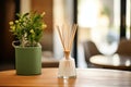 a scent diffuser with wooden sticks on a wooden table Royalty Free Stock Photo