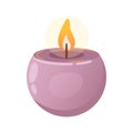 Scented burning round purple candle. Hygge, boho style, creating coziness, interior design. Aromatherapy, wellness