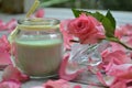 Scented candle and rose