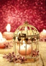 Scented candle in vintage birdcage Royalty Free Stock Photo