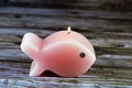 scented fish shaped candle, A candle is an ignitable wick embedded in wax, or another flammable solid substance such as tallow, Royalty Free Stock Photo
