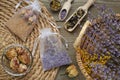 Scented sachets with dried flowers on wooden table, flat lay Royalty Free Stock Photo