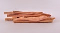 Scented sandalwood sticks isolated, close-up. Aromatic natural wood incenses. Aromatheraphy tradition of India for healthiness.