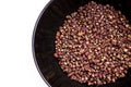 Scented Sichuan pepper in the black bowl on the white table isolated image. Sichuan pepper or Chinese pepper or Timur or Nepali