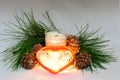 Scented wax candles, Christmas toy heart, cedar cones, cedar branch, Christmas garland, composition Royalty Free Stock Photo