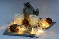 Scented wax candles, three pieces, pine cones, Christmas garland, composition