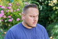 Sceptical young man looking at camera with a dubious expression Royalty Free Stock Photo