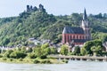 SchÃ¶nburg Castle on the river Rhine, towering above the town of Oberwesel with its colourful Gothic church Royalty Free Stock Photo