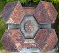 Aerial view of roofs of an old school house with symmetric design