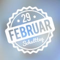 Schalttag 29 Februar Stempel German white on a light blue bokeh fog background.