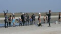 Schastlivtsevo, Ukraine - August 3, 2020: Crowd of peopleapplied to the skin healing black medical mud at the lake of