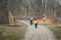 Schaumburg, Illinois USA - March 28, 2018 - The Chicago Athenaeum, International Sculpture Park, Two boys riding on bikes for edi Royalty Free Stock Photo