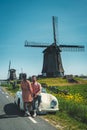 Schermerhorn Alkmaar Netherlands April 2020,. couple doing a road trip with a old vintage sport car White Porsche 356 Royalty Free Stock Photo